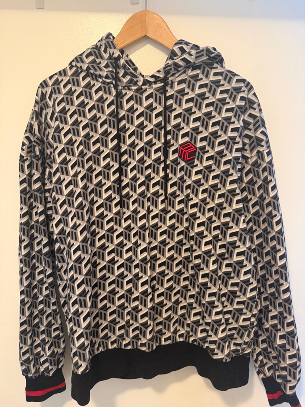 MCM Geometric Pattern Black & White Hoodie with Red Accent